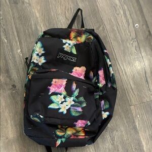 Jansport Black Backpack with Colorful Floral Pattern